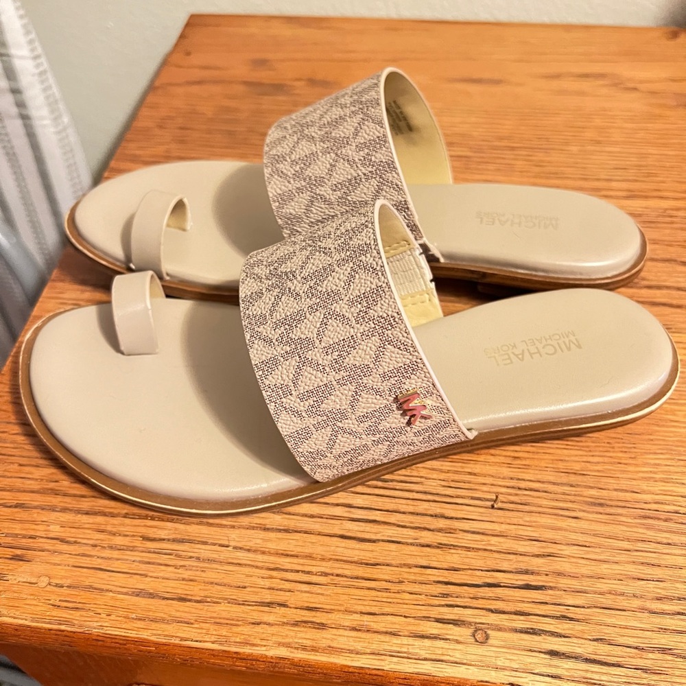 Michael Kors cream sandals.